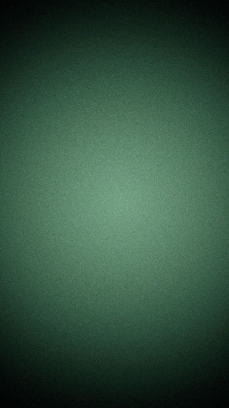 a black and green background with some light