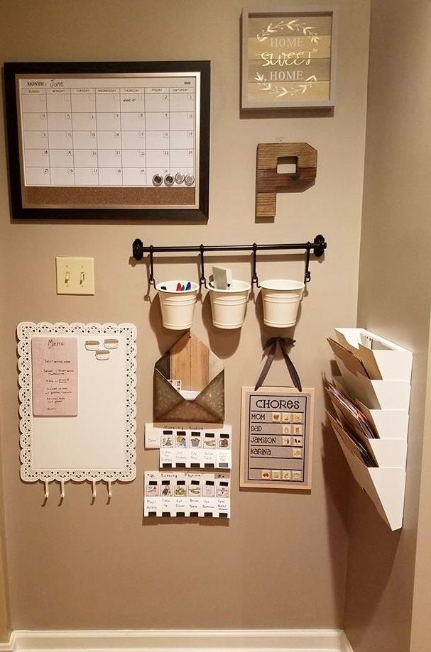 there is a wall with many things on it in the bathroom that are organized and organized