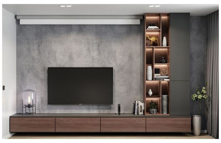 a living room with a large television on the wall and shelves in front of it