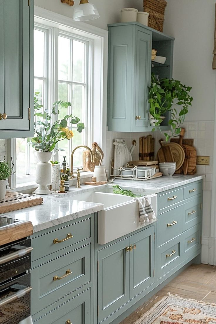 a kitchen with blue cabinets and white counter tops