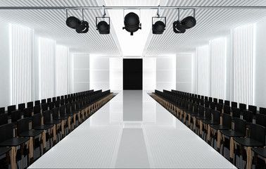 an empty room with rows of chairs and lights