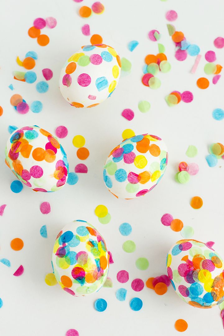 colorful confetti covered eggs sitting on top of a table