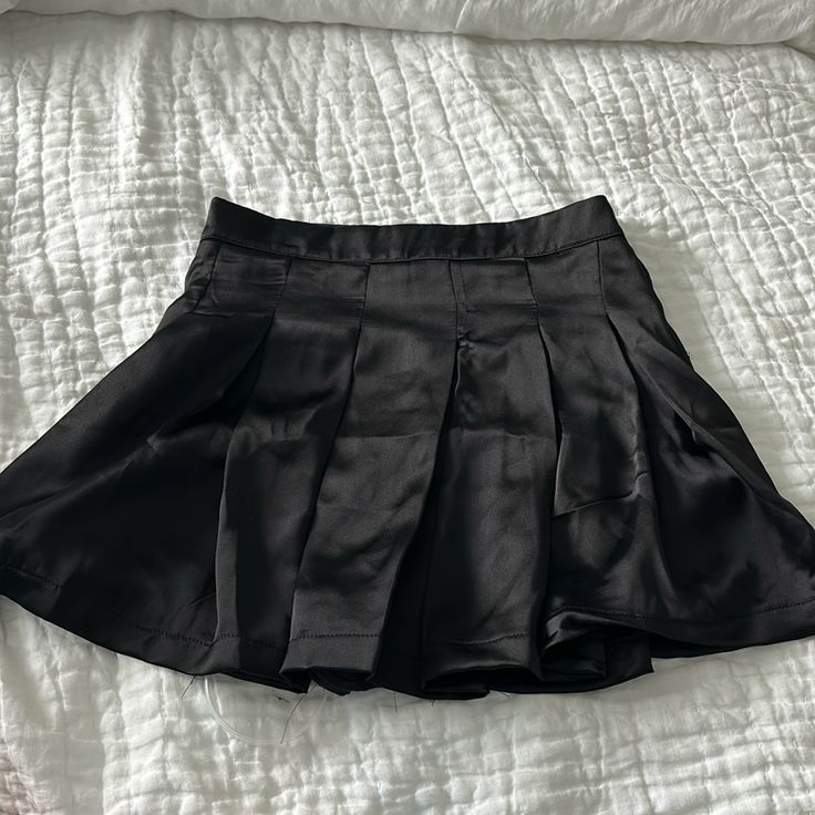 Shorts Built Into Skirt. Tags Attached Never Worn. 100% Polyester. Size Small. Short Pleated Bottoms For Night Out, High Waist Casual Tennis Skirt For Night Out, Casual High Waist Tennis Skirt For Night Out, Black Skirted Pleated Shorts, Black Tennis Skirt With Short Inseam And Lining, Casual Black Shorts With Lined Skirt, Casual High Waist Pleated Skirt For Night Out, Black Mini Skirt For Night Out With Short Inseam, Casual Pleated Skirt Shorts For Party