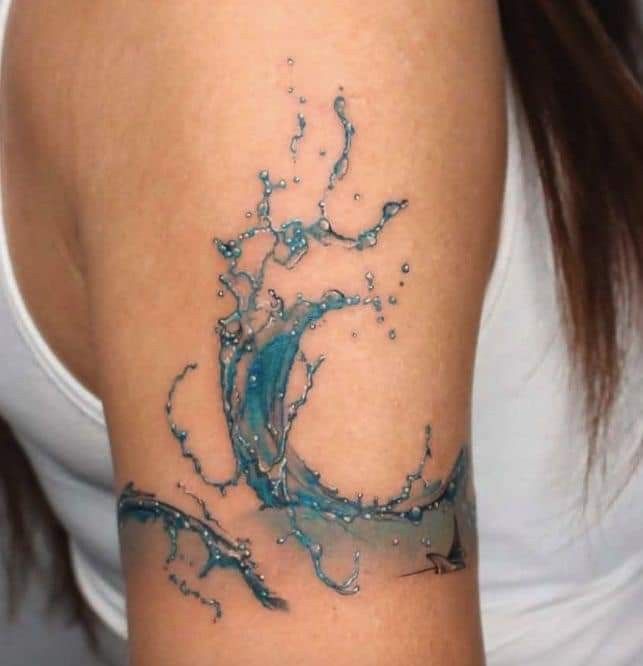 a woman's arm with water splashing on it and an ocean wave in the middle