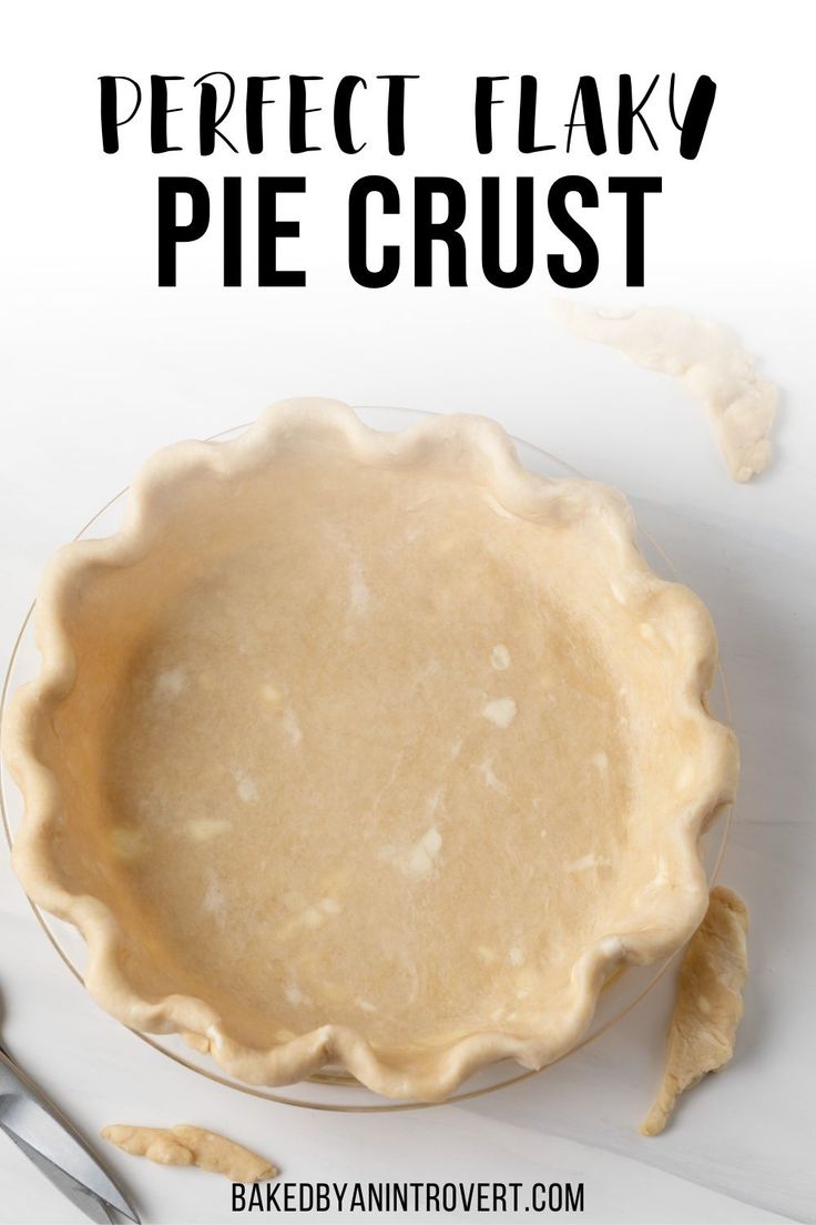 a pie crust on a plate with the words perfect flaky pie crust above it