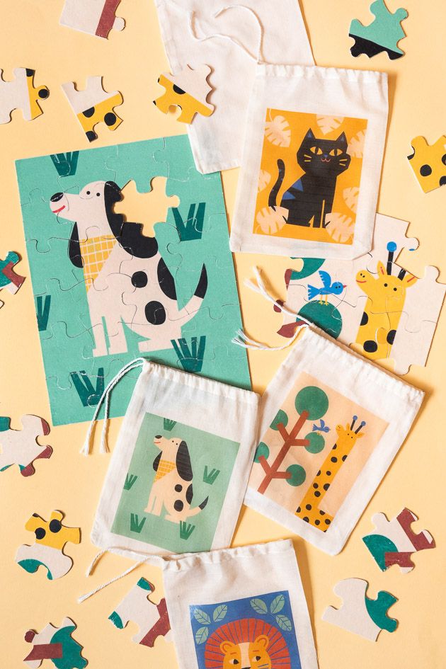 the make your own diy puzzle is shown on a yellow background with animals and trees