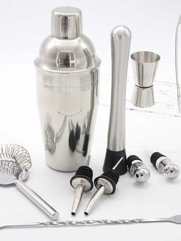 an assortment of kitchen utensils including a cocktail shaker