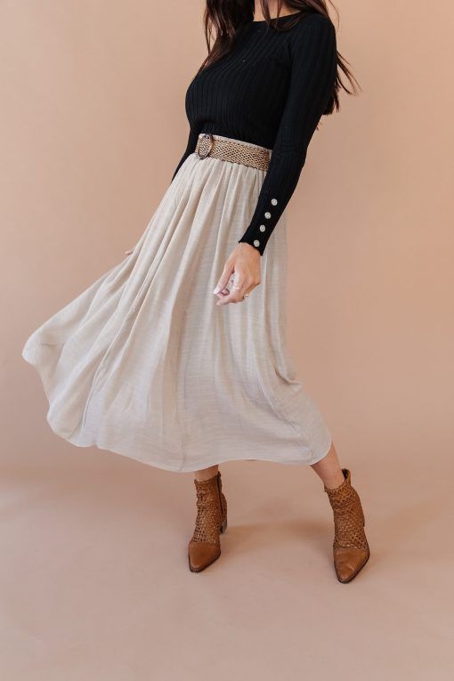 The Hello Honey Skirt is fully lined and the belt is included. It’s the perfect transition piece from winter to spring. Asymmetrical hem. Model is 5’8″ and wearing a Small Fits true to size 65% Viscose 35% Polyester  Skirt has an elastic waistband and a lot of stretch. Small: 0-4 Medium: 6-8 Large: 10-12 Casual Belted Skirt For Fall, Casual Fall Skirt With Belt, Modest Fall Skirt, Modest Fall Skirt With Elastic Waistband, Modest Fitted Bottoms For Fall, Chic Spring Skirt With Belt Detail, Chic Tiered Skirt For Fall, Fall Skirt With Belt Detail, Asymmetrical Maxi Skirt For Day Out In Fall