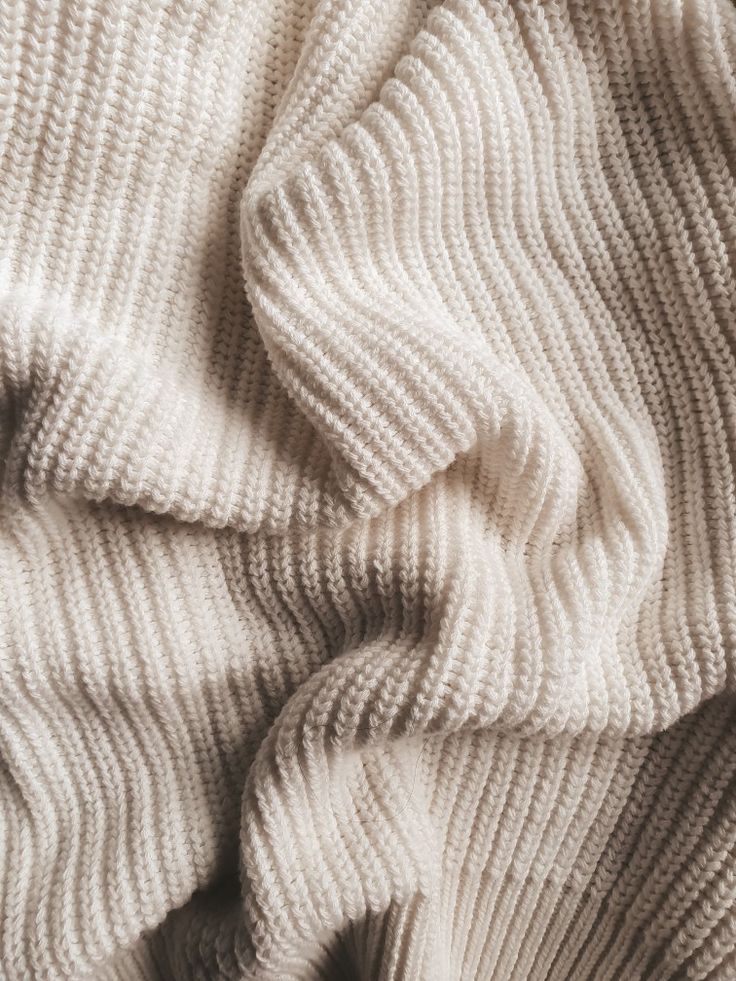 the texture of a white knit fabric