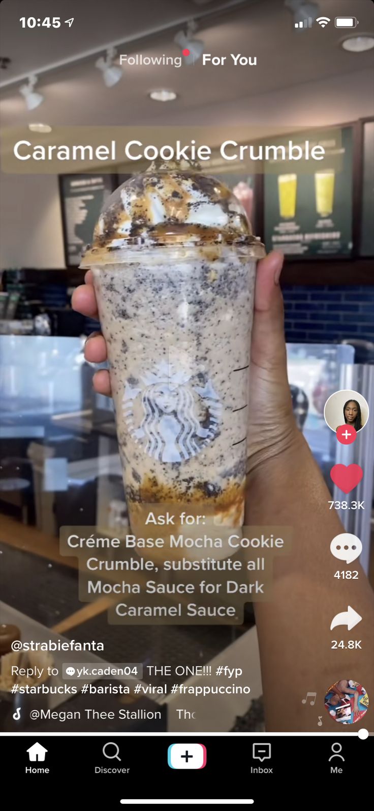 someone holding up a cup with food in it and the caption reads caramel cookie crumble