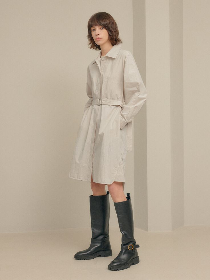 Editor's notesIt is a shirt dress inspired by trench coat design. The dress features a belt, hidden button, top-stitching point, pockets on the front, and side slits. It is a refreshing dress made of cotton fabric.- Relaxed fit- Trench coat design- Top-stitching point- Side slits- 100% CottonMeasurements(in.)One Size- Shoulder: 21.3 in.- Chest: 22.8 in.- Hem: 24.6 in.- Sleeve Length: 20.3 in.- Sleeve: 9.1 in.- Front Length: 39.4 in.- Back Length: 40.9 in.*Model info- Height 5’ 9” Bust 34” Waist Spring Workwear Belted Dress With Pockets, Spring Belted Dress With Pockets For Work, Chic Beige Shirt Dress With Pockets, Spring Business Casual Shirt Dress With Spread Collar, Spring Shirt Dress With Belted Cuffs And Spread Collar, Spring Button-up Belted Dress For Daywear, Spring Shirt Dress With Belted Cuffs, Spring Office Belted Dress, Beige Belted Shirt Dress For Office