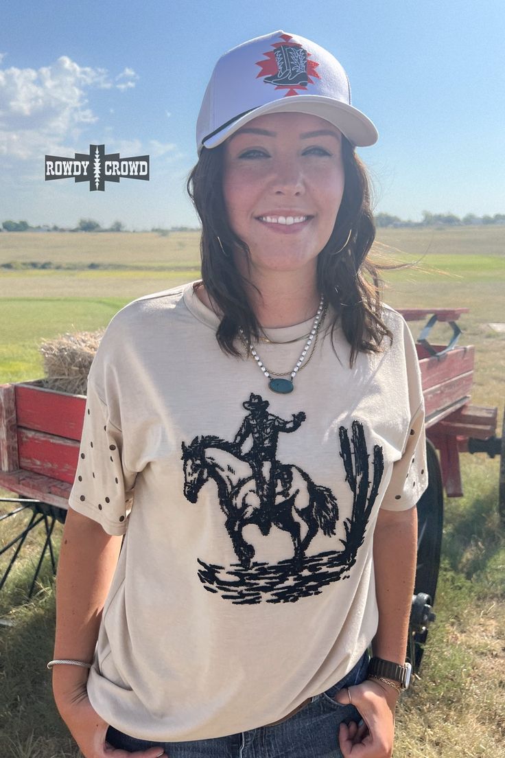 Unleash your wild side with our High Horse Tee! This Western-chic top exudes confidence and daring, perfect for those who crave adventure. Let out a yeehaw and ride into the sunset with style. Black embroidered design Studs on sleeves. Cream-colored tee. 100% Polyester. The sizing chart is located in the pictures. Casual Distressed Tops For Rodeo, Western Style Short Sleeve Summer Tops, Western Crew Neck Tops For Rodeo, Western Style Crew Neck Tops For Fall, Black Western Tops For Summer, Black Western Style Summer Tops, Black Western Style Tops For Summer, Fitted Crew Neck Top For Rodeo, Western Style Short Sleeve Tops For Rodeo