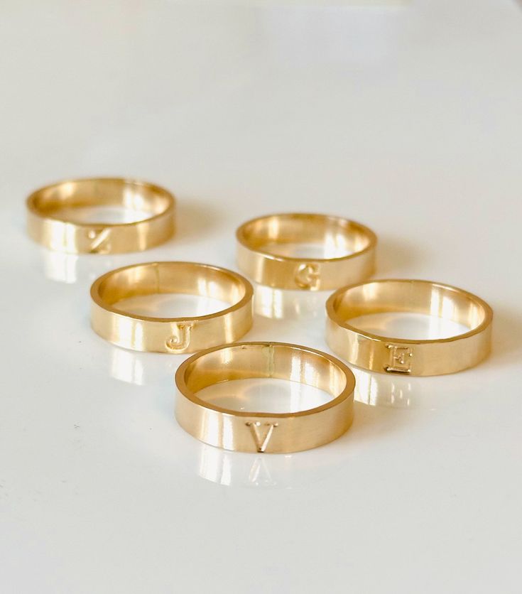 Our initial band is designed with a 4 mm wide band and hand-stamped capitalized initial. Available in a hammered or smooth finish. Choose hammered for texture + high shine or smooth for a soft, satin look. - 14k gold filled or Sterling Silver made to withstand daily wear time after time - *Enter 1 initial in the text box above Please see our 'custom typewriter ring' to customize this band with more letters or numbers. Shop here: https://runeandlight.com/collections/rings/products/custom-typewrit Time After Time, Hammered Band, Gold Filled Ring, Initial Ring, Text Box, The Text, Wide Bands, Typewriter, Runes