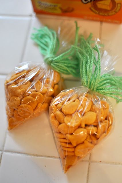 two bags filled with nuts sitting on top of a white tile floor