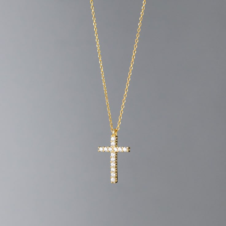 The Cross Necklace For Women The Cross Pendant Necklace embodies classic simplicity, offering a timeless elegance that enhances any outfit. Its sparkling simulated diamond center adds a touch of luxury, creating a refined yet understated look that’s perfect for both casual and formal occasions. Crafted from sterling silver and layered with platinum, this pendant combines durability with a lasting shine. The minimalist cross design brings a subtle sophistication, making it an ideal choice for eve Gold Cross Jewelry, Wishlist Collage, Gold Necklace Cross, Cross Necklace Gold, Cross Choker Necklace, Schmuck Gold, Gold Schmuck, Jewelry Cross, Cross Choker