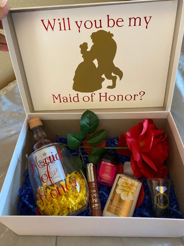 an open box with various items in it and the words will you be my maid of honor?