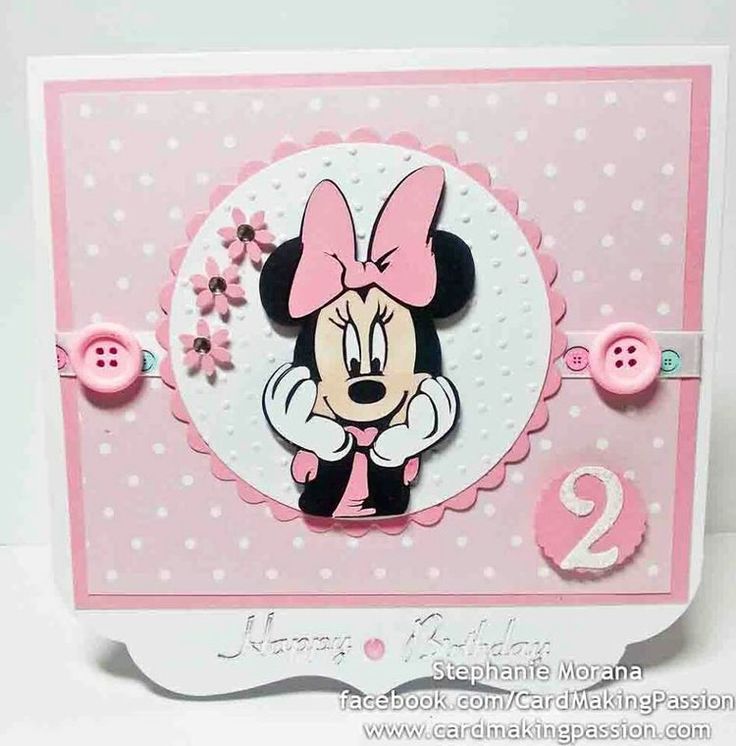 a pink and white card with minnie mouse on it