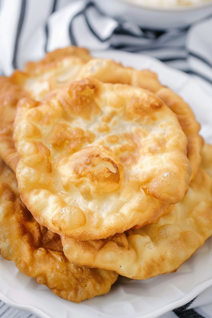 some food is on a white plate and it looks like they are made out of cheese