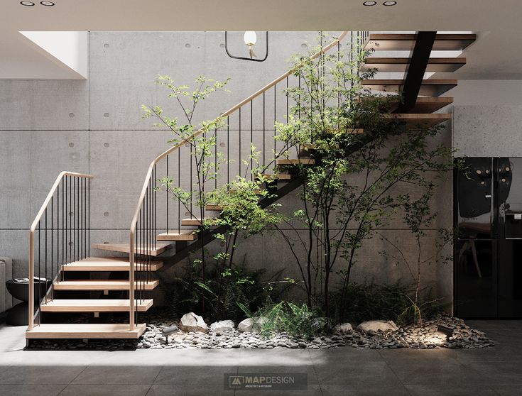 an indoor stair case with plants and rocks