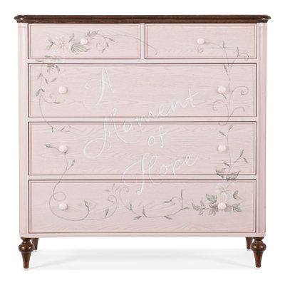 a pink dresser with flowers painted on the drawers and lettering that says i love you