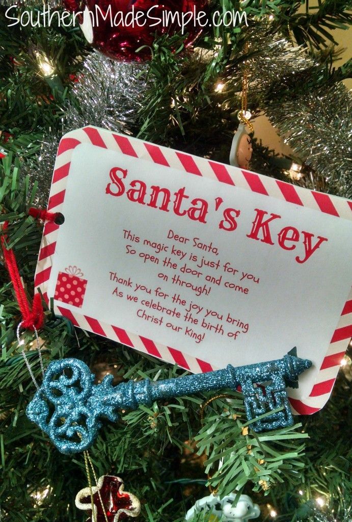 a christmas ornament hanging from the tree with santa's key on it