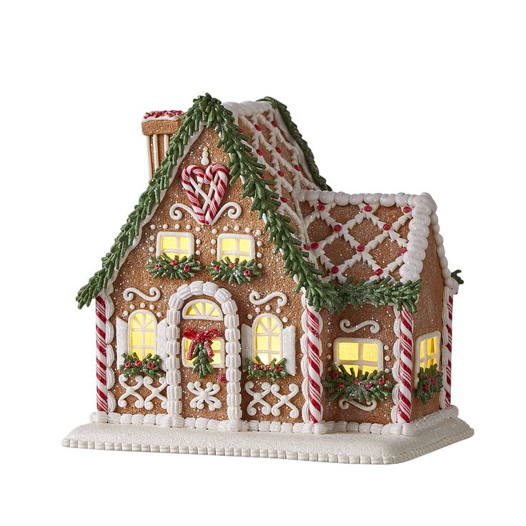 a gingerbread house with lights and candy canes