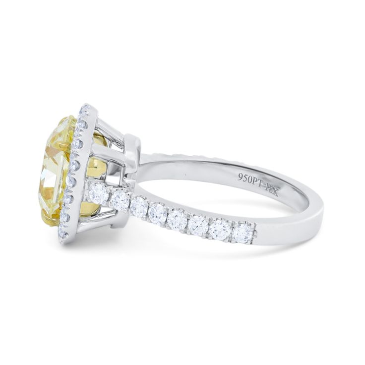 18kt White Gold Cushion Engagement Ring: 5.01ct fancy yellow cushion cut diamond, FLY VS1 Surrounded by 1.25cts of diamonds GIA certified Yellow Oval Brilliant Cut Diamond Ring, Yellow Diamond Ring With Cushion Cut, Luxury Yellow Rings With Single Cut Diamonds, Yellow Diamond Ring With Center Stone, Luxury Yellow Diamond Ring, Formal Yellow Cushion Cut Diamond Ring, Yellow Cushion Cut Diamond Ring With Center Stone, Yellow Cushion Cut Diamond Ring With Halo Setting, Formal Yellow Diamond Ring With Single Cut Diamonds