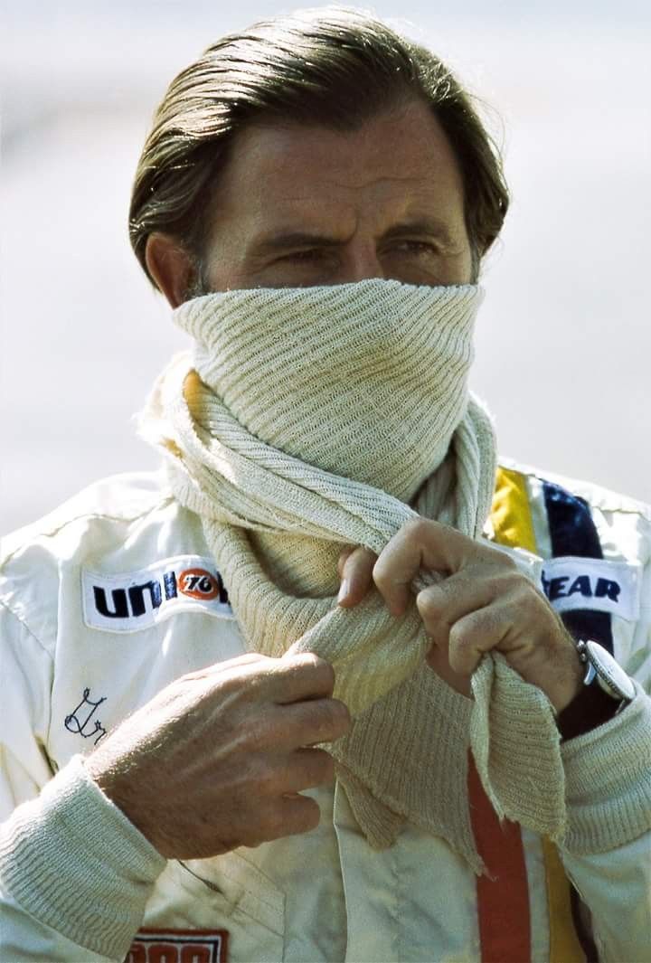 a man with a scarf wrapped around his face