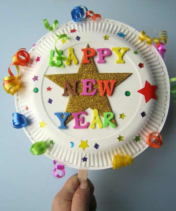 a paper plate with the words happy new year on it