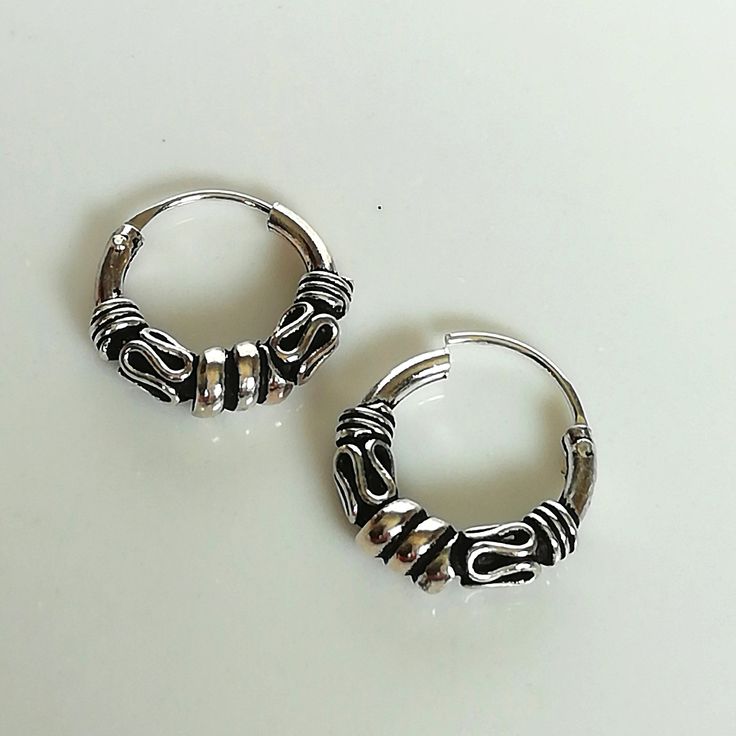 Bali style sterling silver ear hoops. Dimensions: 1.5 x 12 mm Price is for ONE PAIR. These earrings are made of 925 hypoallergenic sterling silver. Most of my pieces come with a 925 stamp. Can be packaged in a gift box. I can include a personal message from you if needed You are welcome to contact me at... bhavnakwintra1956@gmail.com For more beautiful pieces from my shop, please browse 👇 TOE RINGS: https://www.etsy.com/your/shops/TheSilverGame/tools/listings/section:27020628,view:table EAR HOO Silver Huggie Septum Ring For Everyday, Internally Threaded Round Silver Hoop Earrings, Silver Internally Threaded Round Hoop Earrings, Sterling Silver Hoop Earrings Internally Threaded, Sterling Silver Internally Threaded Hoop Earrings, Everyday Hoop Septum Ring In Sterling Silver, Sterling Silver Hoop Septum Ring, Everyday Sterling Silver Hoop Septum Ring, Nickel Free Small Hoop Sterling Silver Piercings