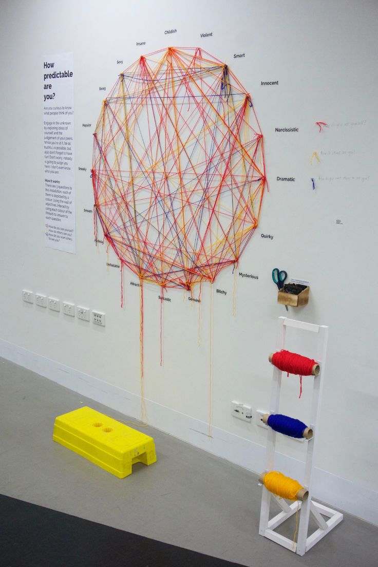 an art installation on the wall with different colored objects