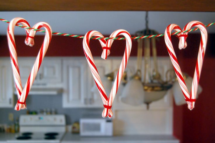 some candy canes hanging from a kitchen line