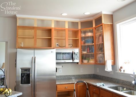 a stainless steel refrigerator freezer sitting inside of a kitchen