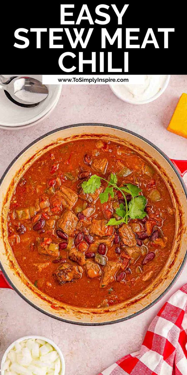 an easy stew with meat and vegetables in a skillet on a red checkered table cloth