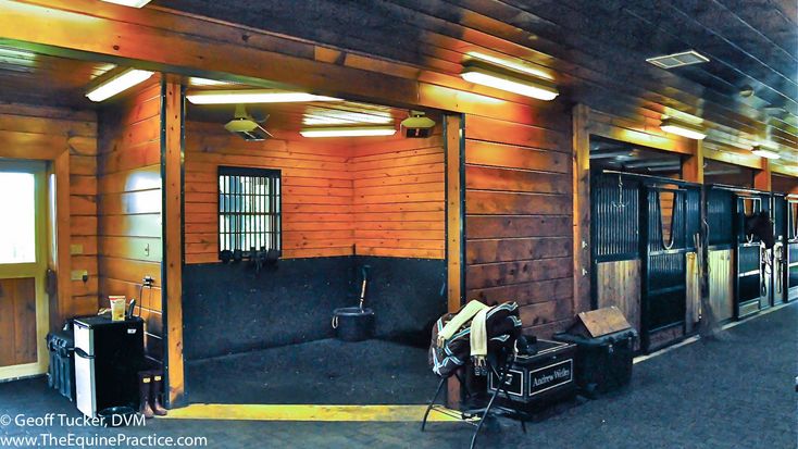 the inside of a building with wooden walls and doors