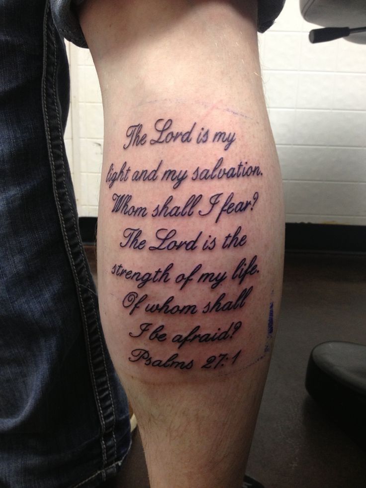 a man's leg with a bible verse tattoo on his left calf and the words, he lord is my salvation