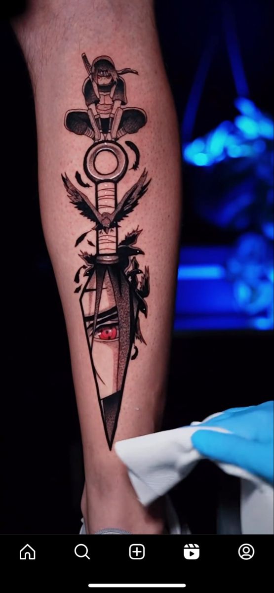 a person with a tattoo on their leg that has an arrow and arrows in it