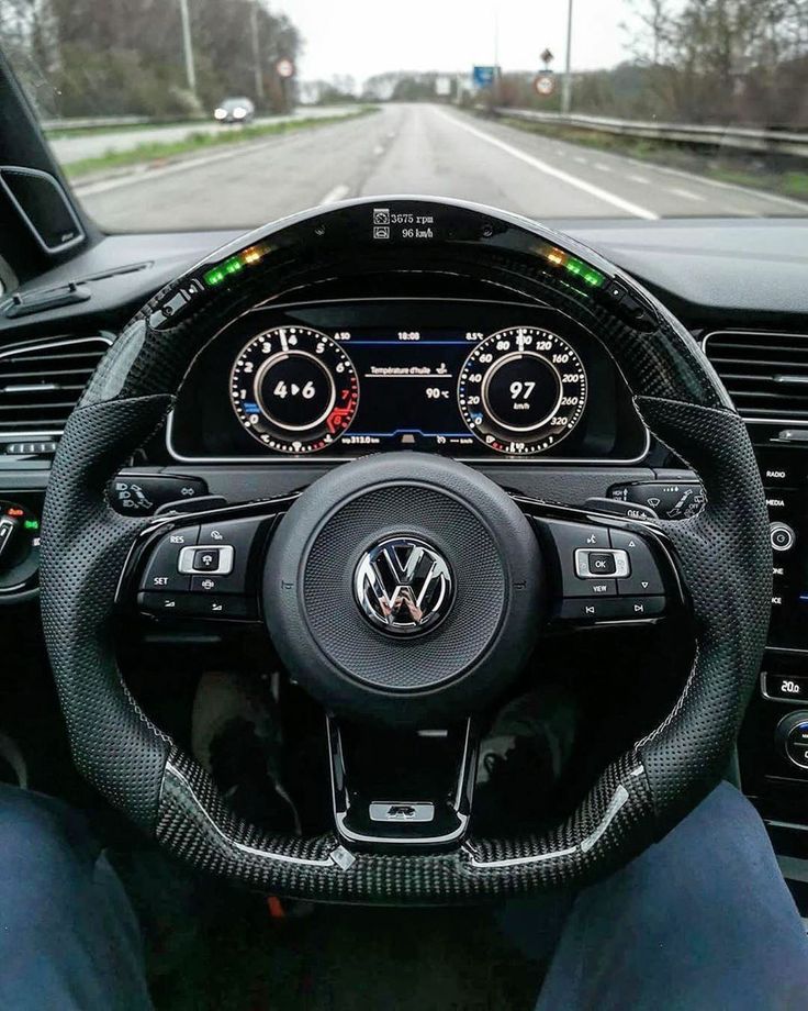 the steering wheel and dashboard of a volkswagen car