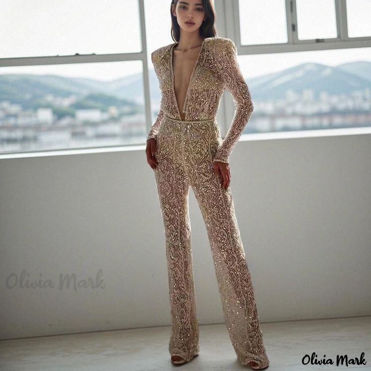 Olivia Mark - Chic and Sexy Golden Long-Sleeved Jumpsuit with Long Trousers Long Sleeve Sequined Jumpsuits And Rompers For Party Season, Long Sleeve Sequined Jumpsuits For Party Season, Long Sleeve Sequined Jumpsuits And Rompers For Night Out, Fitted V-neck Jumpsuits And Rompers For Party, Long Sleeve Sequined Jumpsuits For Night Out, Fitted V-neck Jumpsuits For Party, Long Sleeve Stretch Jumpsuits For Evening, Glamorous Fitted Full-length Jumpsuits And Rompers, Glamorous Fitted Full-length Jumpsuit