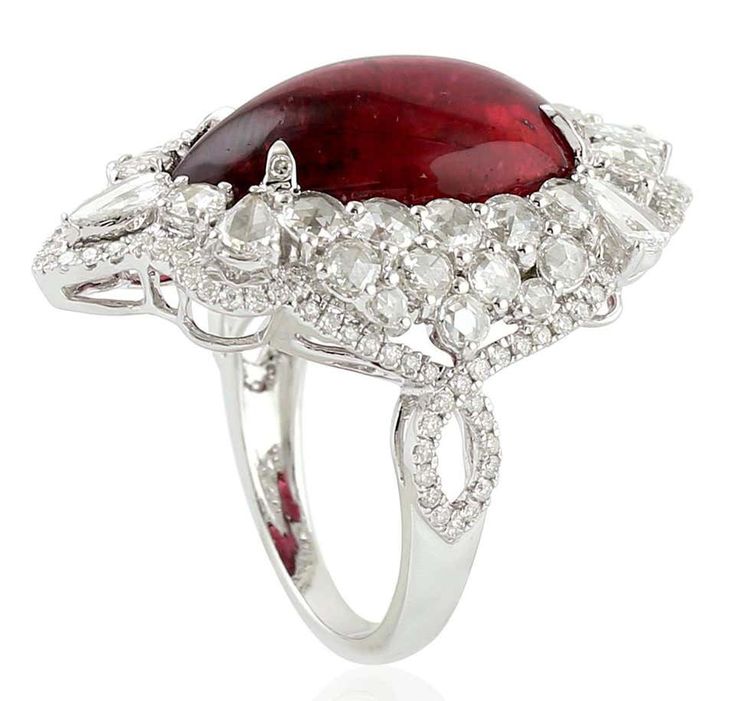 For Sale on 1stDibs - This stunning statement ring has been crafted from 14-karat gold. It is set in 13.65 carats Rubelite and 2.14 carats glimmering diamonds. The ring is a Luxury Pear-shaped Ruby Ring, Luxury Pear-shaped Ruby Ring For Formal Occasions, Luxury Pear-shaped Ruby Wedding Ring, The Ring, Cocktail Ring, Cocktail Rings, Statement Ring, Statement Rings, Diamonds