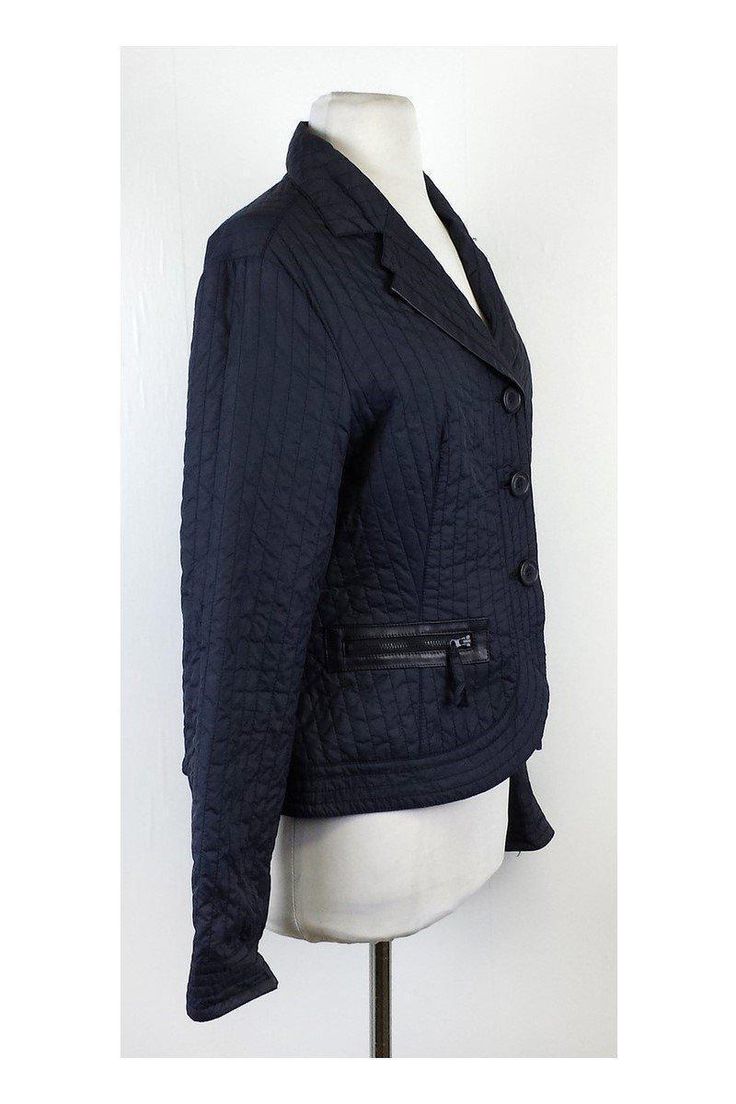 This navy quilted jacket is the perfect layering piece. Black faux leather details and waist zip pockets give it a bit of an edge. Size 8 Body 100% Nylon Combo 100% Polyamide Buttons on front Waist zips Shoulder to Hem 23.5" Giorgio Armani is an Italian fashion designer known for his classic and luxurious style. First known for menswear, Armani has since branched out to all avenues of fashion. Armani is now best known for clean, tailored lines and fragrances. Fitted Quilted Jacket With Padded Collar For Work, Quilted Jacket With Zipper For Fall Workwear, Fall Quilted Workwear Jacket With Zipper, Fall Quilted Jacket With Zipper Closure For Workwear, Fall Quilted Jacket For Work With Zipper, Casual Nylon Quilted Jacket For Work, Quilted Fitted Outerwear For Work, Fitted Quilted Outerwear For Work, Long Sleeve Quilted Jacket With Zipper For Work