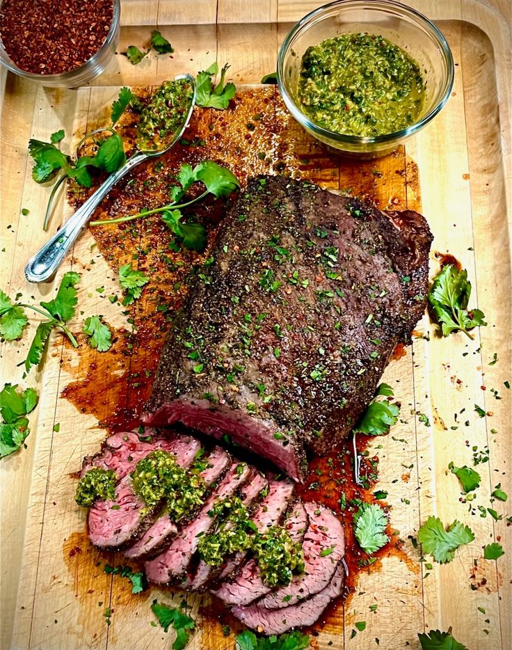 the steak is prepared and ready to be served on the grilling board with other ingredients