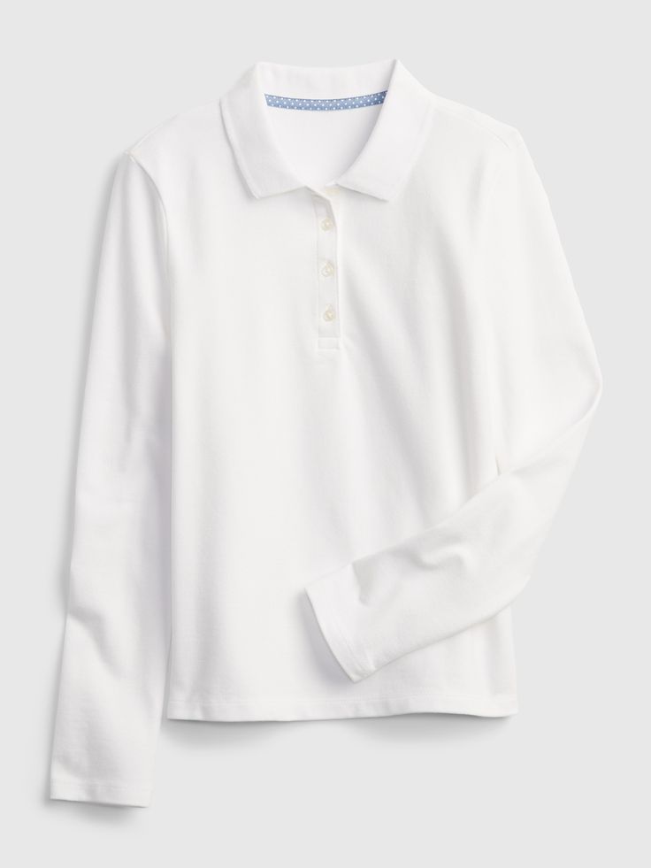 Made with 97% organically grown cotton.  Organic cotton is better for people and the environment because it's grown without the use of harmful synthetic pesticides and fertilizers.  Soft woven knit uniform polo shirt.  Spread collar, buttons at front.  Long sleeves.  This shirt was made in a factory that runs the Gap Inc.  P. A. C. E.  Personal Advancement & Career Enhancement) program.  P. A. C. E.  is our educational program that helps the women who make our clothes build the skills, knowledge White Polo Outfit Women Long Sleeve, White Polo Outfit Women, White Polo Outfit, Kids Uniform, Polo Outfit, School Uniform Outfits, Kids Uniforms, Uniform Pants, White Polo Shirt