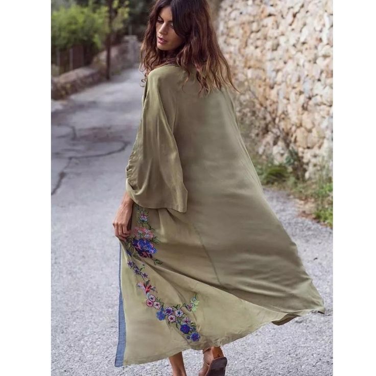 Lounge in luxury. This Long Kimono Duster features a bohemian floral embroidery and print along the front contrast edges, an oversized silhouette, open front, kimono sleeves, and a maxi length. Pairs well with a tank and denim, or as a kaftan swimsuit cover up. We love the relaxed vibes it emanates and if you're into robes, you get it. She's almost sold out, so grab before she's gone for good. Fabric Composition Main: Rayon, Viscose. Embroidery, Print. Size Guide One Size: Bust 42'' This item is Sunscreen Clothing, Beach Tunic, Beach Kimono, Wedding Kimono, Kimono Vintage, Beachwear Collection, Hippy Chic, Vintage Swimwear, Long Kimono