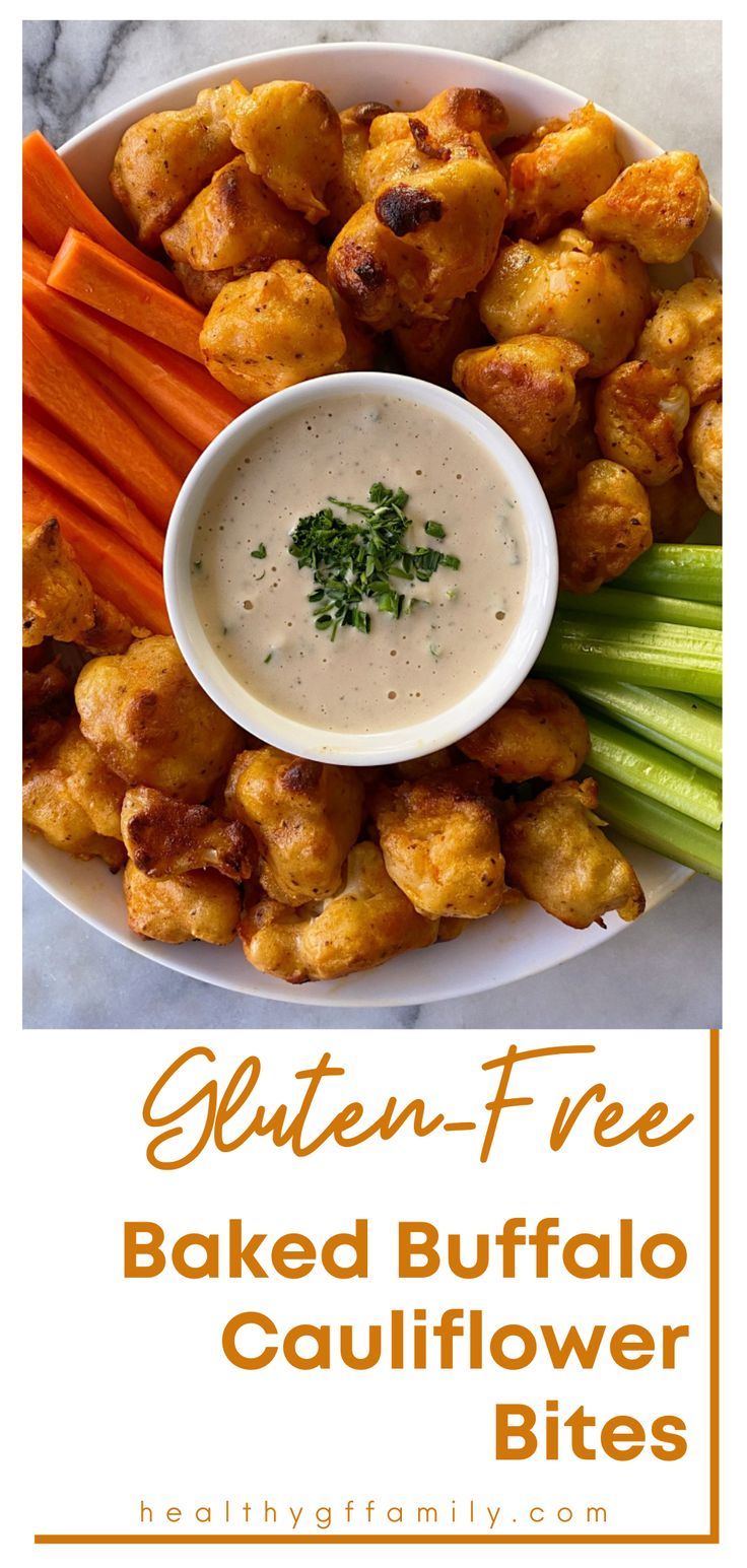 baked buffalo cauliflower bites on a plate with ranch dip and celery