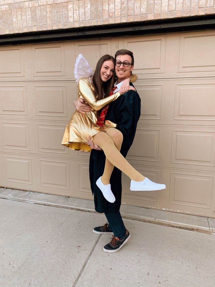 a man and woman dressed up in costumes posing for a photo with their arms around each other