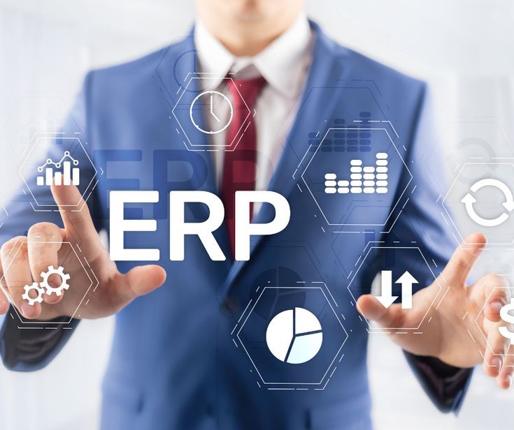 a man in a blue suit is holding up his hands with erp icons on it