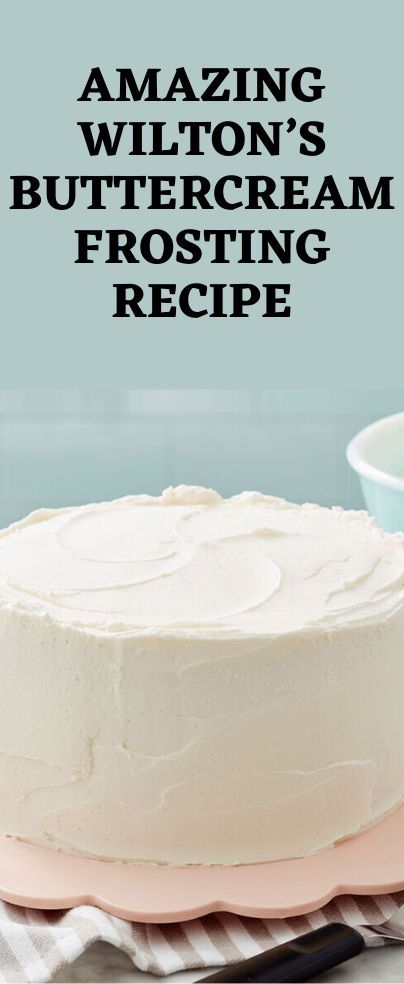 a white frosted cake sitting on top of a pink plate