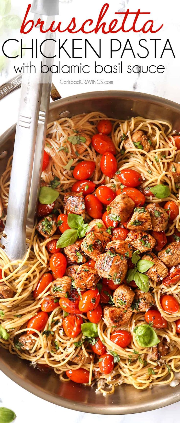 chicken pasta with tomatoes and basil in a skillet