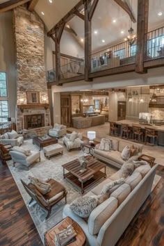 a large living room with high ceilings and wooden floors